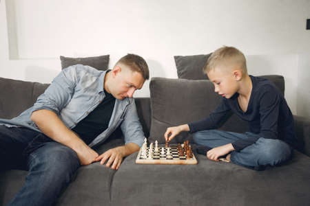 Father with son plays in a chessの写真素材