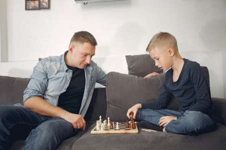 Father with son plays in a chessの写真素材