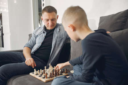 Father with son plays in a chessの写真素材