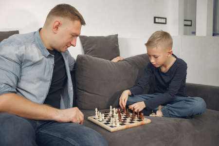 Father with son plays in a chessの写真素材
