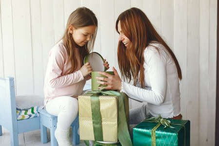 Mother and little daughter have fun at homeの写真素材