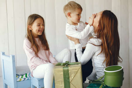 Family sitting at home with presentsの写真素材
