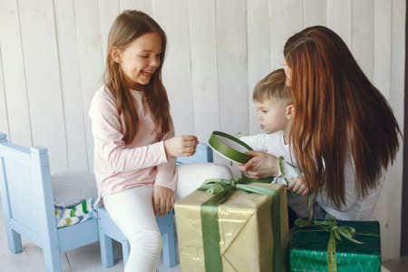 Family sitting at home with presentsの写真素材
