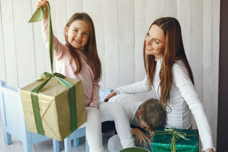 Family sitting at home with presentsの写真素材