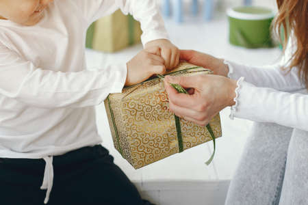 Family sitting at home with presentsの写真素材