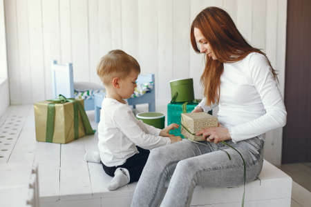 Family sitting at home with presentsの写真素材