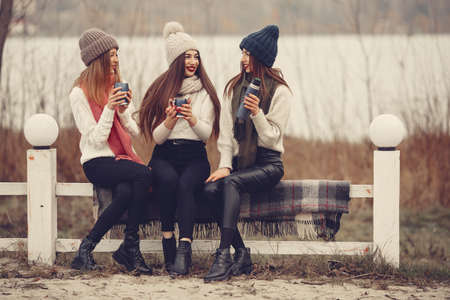 Women in a winter park without snowの写真素材
