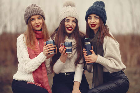 Women in a winter park without snowの写真素材