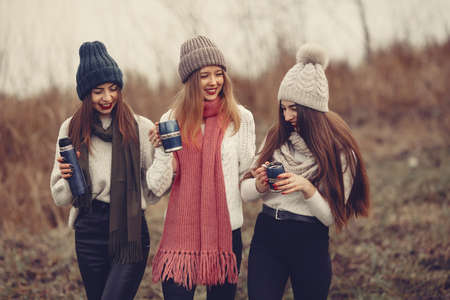 Women in a winter park without snowの写真素材