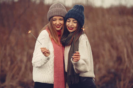 Women in a winter park without snowの写真素材