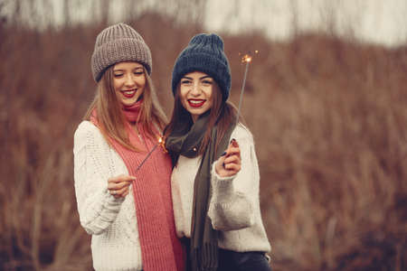 Women in a winter park without snowの写真素材