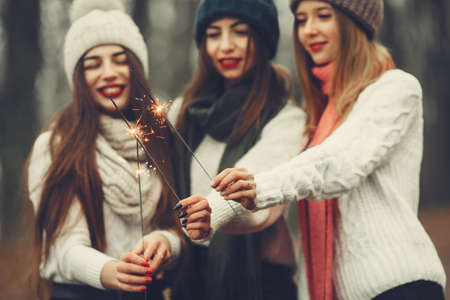 Women in a winter park without snowの写真素材