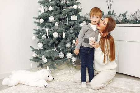 Mother with son in a Christmass decorationsの写真素材