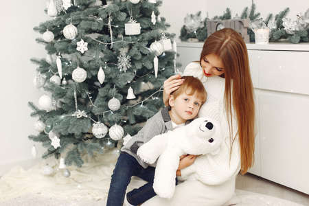 Mother with son in a Christmass decorationsの写真素材