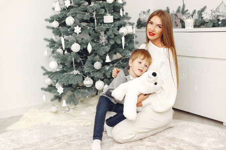 Mother with son in a Christmass decorationsの写真素材