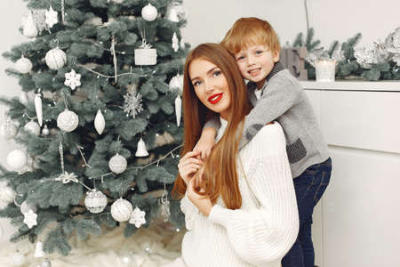 Mother with son in a Christmass decorationsの写真素材