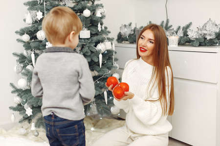 Mother with son in a Christmass decorationsの写真素材