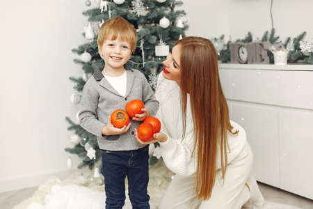 Mother with son in a Christmass decorationsの写真素材