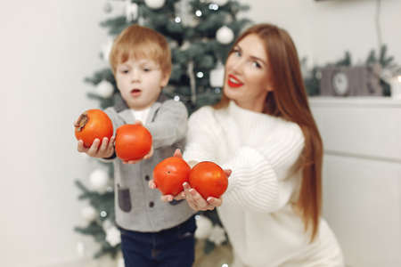 Mother with son in a Christmass decorationsの写真素材