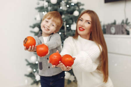 Mother with son in a Christmass decorationsの写真素材