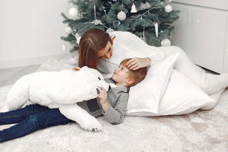 Mother with son in a Christmass decorationsの写真素材