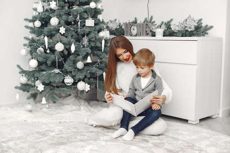 Mother with son in a Christmass decorationsの写真素材