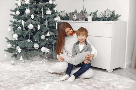 Mother with son in a Christmass decorationsの写真素材