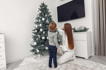 Mother with son in a Christmass decorationsの写真素材