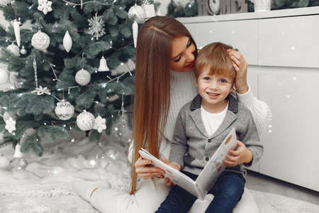 Mother with son in a Christmass decorationsの写真素材