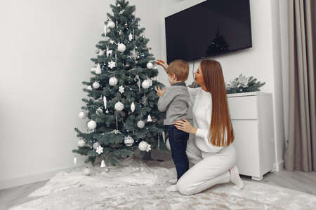 Mother with son in a Christmass decorationsの写真素材