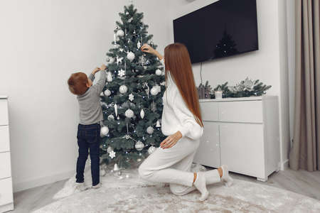 Mother with son in a Christmass decorationsの写真素材