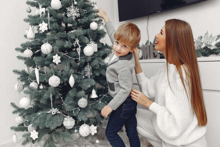 Mother with son in a Christmass decorationsの写真素材