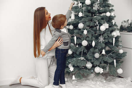 Mother with son in a Christmass decorationsの写真素材