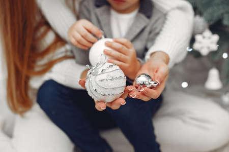 Mother with son in a Christmass decorationsの写真素材
