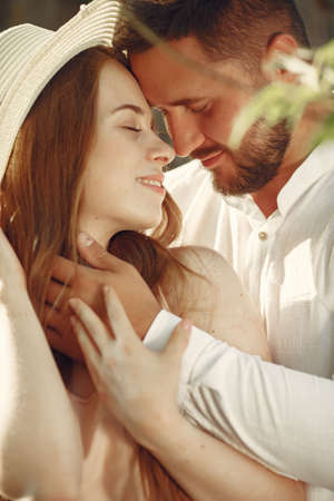 Beautiful couple spend time on a summer fieldの写真素材