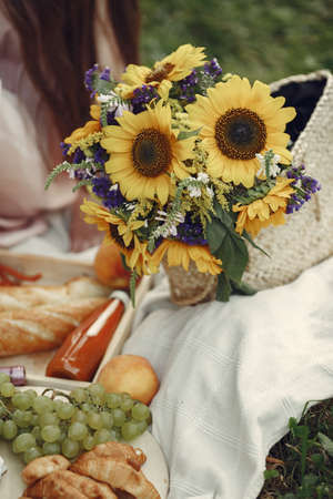 Beautiful couple spend time on a summer fieldの写真素材