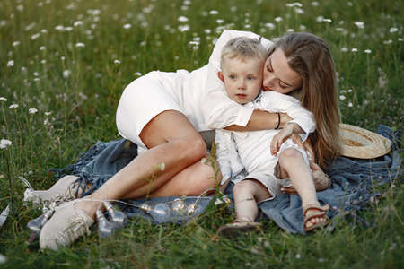 Mother with son resting in the park.の写真素材