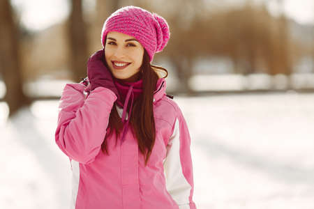 Woman in winter sports clothes looking at cameraの写真素材
