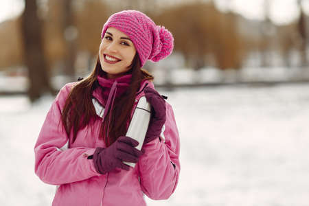 Woman in winter sports clothes looking at cameraの写真素材