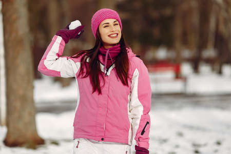 Woman in winter sports clothes looking at cameraの写真素材