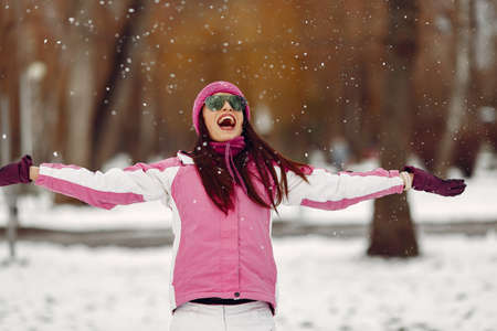 Woman in winter sports clothes looking at cameraの写真素材