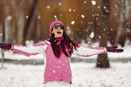 Woman in winter sports clothes looking at cameraの写真素材