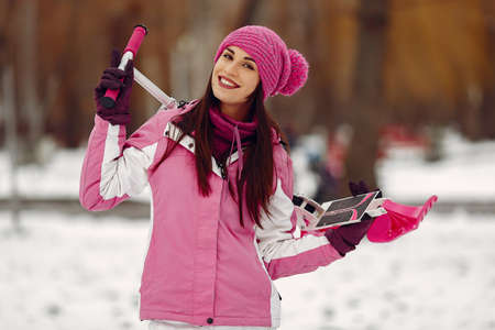 Woman in winter sports clothes looking at cameraの写真素材