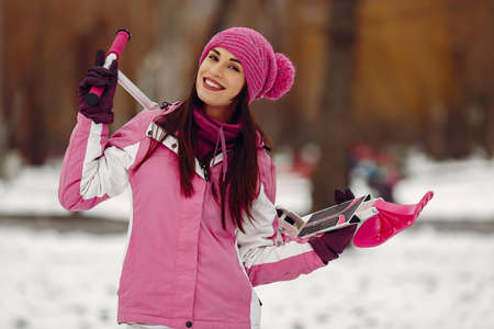 Woman in winter sports clothes looking at cameraの写真素材