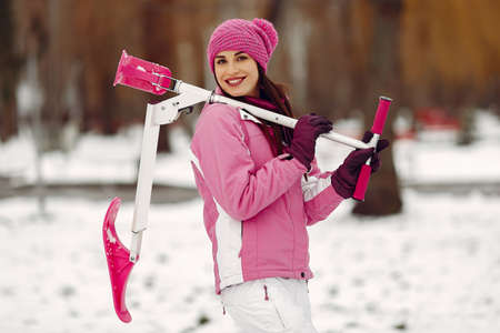 Woman in winter sports clothes looking at cameraの写真素材
