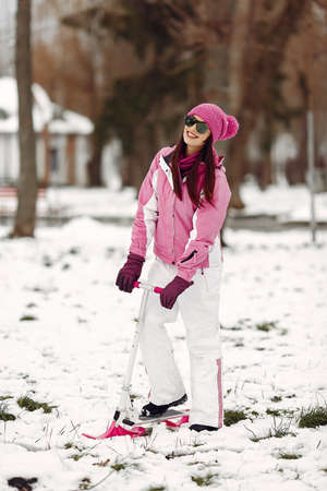 Woman in winter sports clothes looking at cameraの写真素材