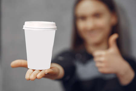Young barista girl makes coffee and smilesの写真素材