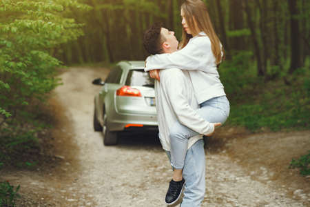 Beautiful couple spend time in a spring forestの写真素材