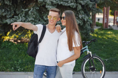 Couple riding bikes in summer cityの写真素材