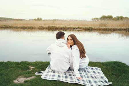 Beautiful couple spend time in a spring forestの写真素材